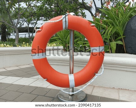 orange swimming buoy around the swimming pool 