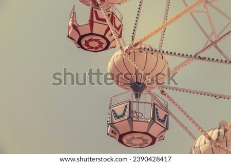 Ferris wheel on the background of blue sky Royalty-Free Stock Photo #2390428417