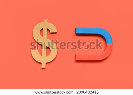 Horseshoe shaped magnet with dollar sign on red background. Attracting investments concept