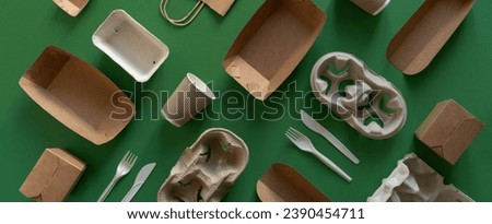 Packaging concept - selection of paper craft packaging on green background