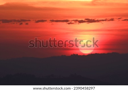 rising sun picture with orange red sky