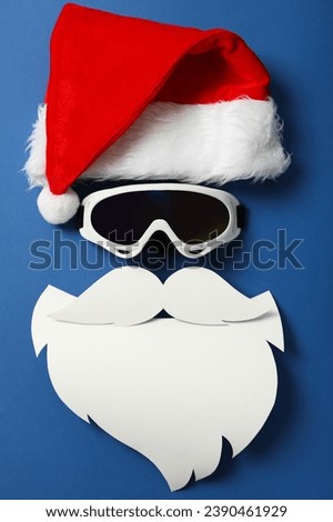 Santa hat with beard, mustache and ski goggles