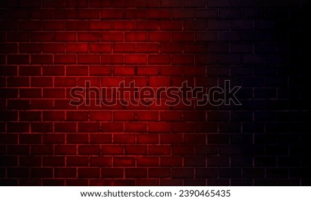 Neon lights on old grunge brick wall room background..Empty space of Red brown vintage grunge brick wall texture background. Royalty-Free Stock Photo #2390465435