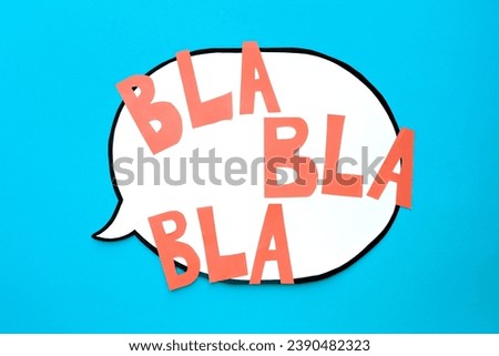Speech bubble with a text Bla-bla-bla on a blue background. Comic cloud  Royalty-Free Stock Photo #2390482323