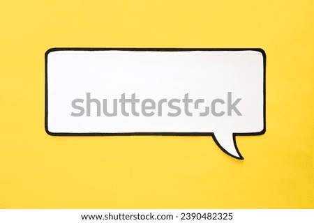 Speech bubble on a yellow background. Comic cloud with a place for text Royalty-Free Stock Photo #2390482325