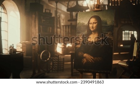 Eternal Beauty Captured on Canvas in Renaissance Art Workshop: The Famous Painting of the Mona Lisa Resting on a Wooden Easel in an Old Antique Studio. High Art and Genius Talent Concept Royalty-Free Stock Photo #2390491863