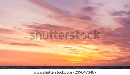 Landscape horizon sea, Sunset sky clouds over sea in the Evening with Dramatic Orange, Yellow, Pink sunlight in golden hour sky background, Majestic nature landscape  