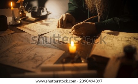 Close Up on Hand of Old Renaissance Male Using Ink and Quill to Write New Ideas. Dedicated Historian Taking Notes, Writing a Book about the Important and Innovative Eras in the History of Humanity Royalty-Free Stock Photo #2390494397