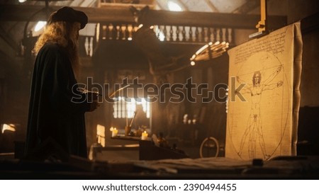 The Blend of Art and Science: Documentary Shot of Leonardo Da Vinci Working on his Famous Piece of the Vitruvian Man in his Workshop. Historical Moment Depiction of Talent and Brilliance Royalty-Free Stock Photo #2390494455