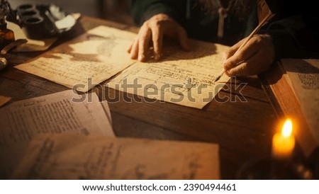 Close Up on Old Renaissance Male Hand Using Ink and Quill to Draw a Blueprint for a New Invention. Dedicated Inventor Working on an Innovative Creation, Writing Notes and Observations Royalty-Free Stock Photo #2390494461