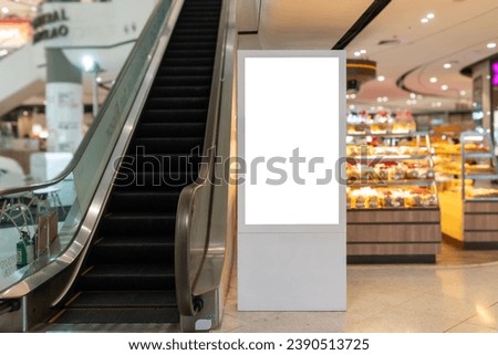 Create eye-catching advertisements mockup of a digital signage display on an escalator side. Royalty-Free Stock Photo #2390513725