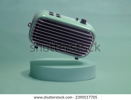 golden oldies funky portable bluetooth speaker  Royalty-Free Stock Photo #2390517705