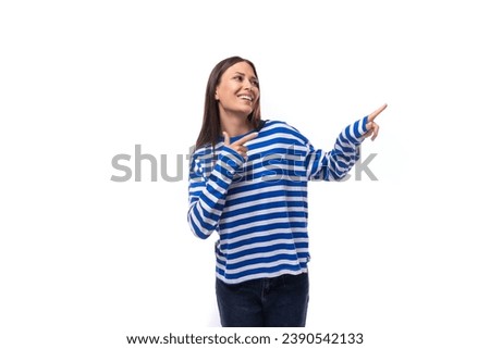 young smiling slender european brunette woman dressed in a casually striped sweater