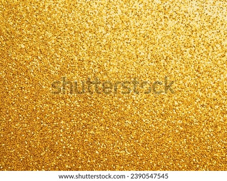 Golden glittering background using as festive luxury background with space for text or image