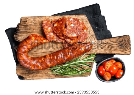 Dry cured Spanish Chorizo sausage, slices of meat with herbs and spices. Isolated, white background Royalty-Free Stock Photo #2390553553