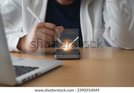 Businessman using pen to tick correct sign mark on checklist for quality control assurance of ISO concept. Business performance checklist,Quick checklist and clipboard management concept. checklis.