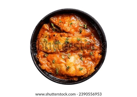 Baked halibut fish in a pan with tomato sauce. Isolated, white background