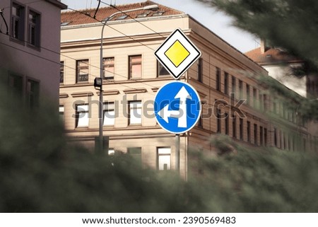 Traffic on a pole with traffic signs main road