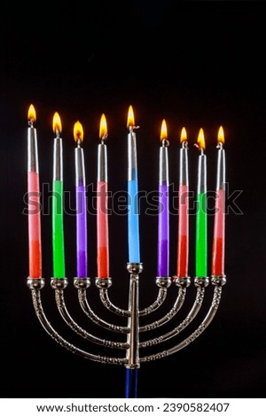 Traditional Hanukkah religious symbol depicting Hanukkah menorah with candles burning on it