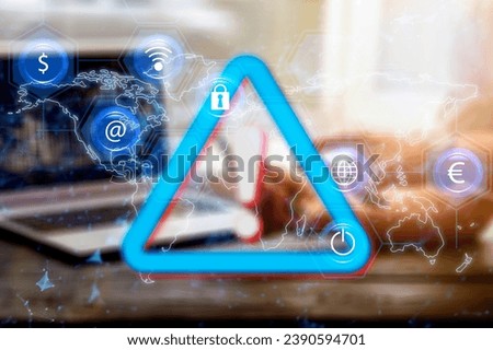 Businessman hands on laptop with warning sign.