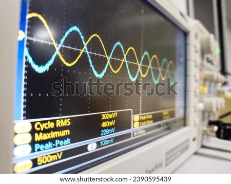 Oscilloscope measuring sine wave, alternate current, eletronic analogic, double wave, phase Royalty-Free Stock Photo #2390595439