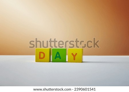 day lettering made multicolored blocks