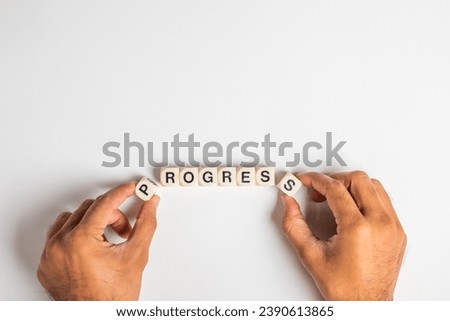 Progress Word dice human hand completing word progress , isolated on white background