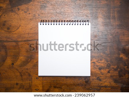 Blank notepad on wooden table 