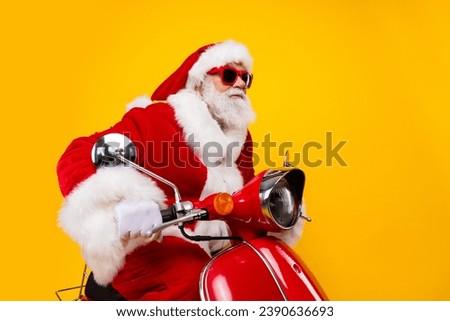 Photo of positive saint nicholas riding moped fast speed winter december eve noel shopping courier isolated on yellow color background Royalty-Free Stock Photo #2390636693