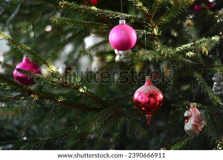 Old Fashioned Christmas Ornaments. Christmas ornaments, vintage glass baubles on a Christmas tree. Royalty-Free Stock Photo #2390666911