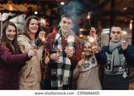 Group funny people winter holidays. Christmas concept with firework sparkler