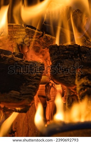 close-up of a burning fireplace, the heat almost emanating from it. Royalty-Free Stock Photo #2390692793