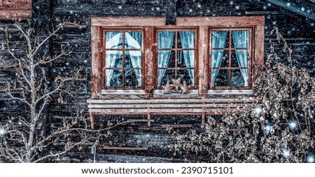 traditional Swiss wooden hut and snowfall