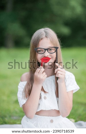 Girl with fake glasses and lips.