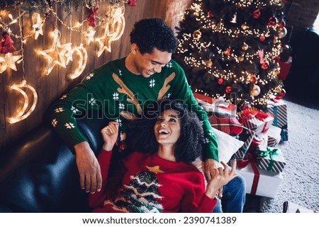 Top photo of two lovers wife husband enjoy christmas event occasion together lying in cozy garlands indoors room