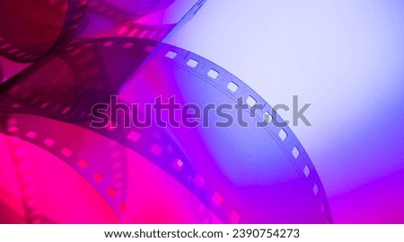 abstract color background with film strip Royalty-Free Stock Photo #2390754273