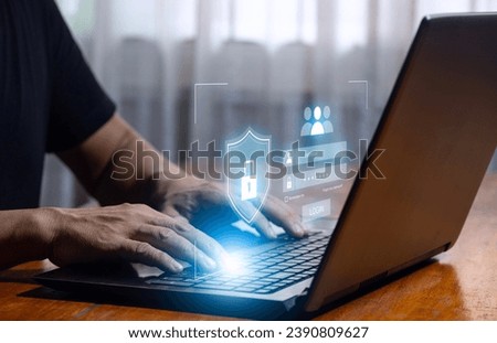 Man using laptop computer with virtual login screen for identification and password, technology security and hacker protection concept