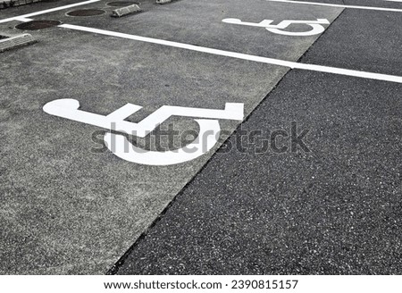 Wheelchair Accessible Parking Sign on Asphalt Ground.