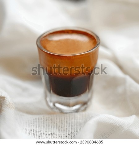 Cup of hot espresso coffee,glass of hot black coffee put on   background