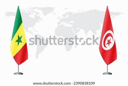 Senegal and Tunisia flags for official meeting against background of world map.
