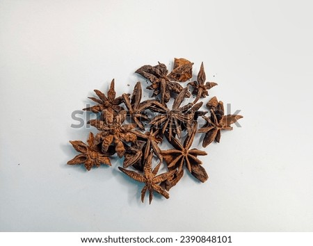 group of star anise flowers isolated on an unclean white background