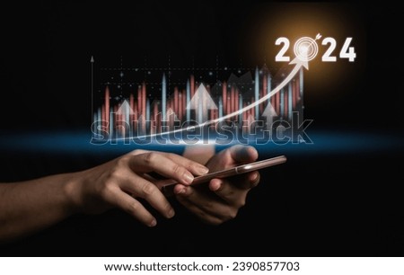 2024 business target goal finance technology and investment stock market trading concept. businessman using mobile virtual graph icon analyzing forex or crypto currency trading graph financial data.