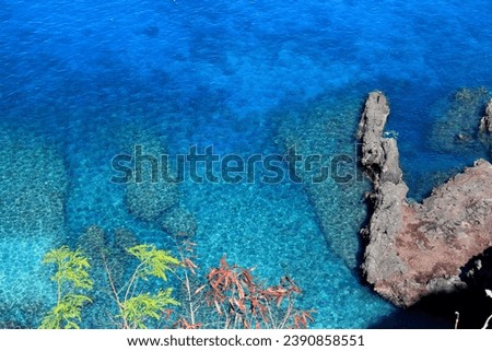 Beautiful and vibrant coral reefs and dark blue sea in tropical Senggigi Beach, Lombok Indonesia