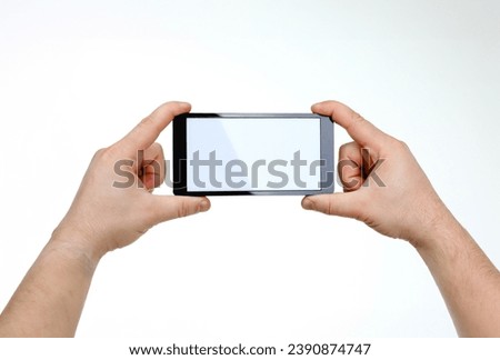 Male hand hoding smartphone isolated on white background. You can insert an image image of your text for the concept or project development of mobile applications and their advertising mobile devices