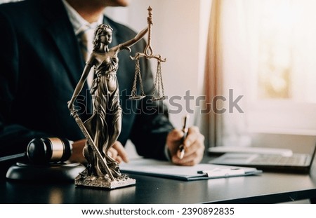 Judge gavel with Justice lawyers having team meeting at law firm background. Concepts of Law and Legal services. Royalty-Free Stock Photo #2390892835
