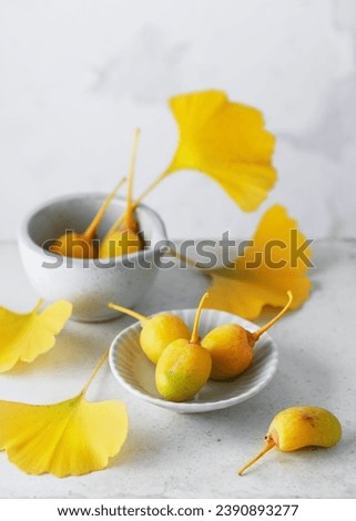 Organic ripe ginkgo fruit fresh yellow leaves in traditional Chinese medicine. Popular nutritional supplement. Copy space. Royalty-Free Stock Photo #2390893277