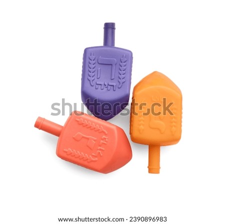Colorful dreidels isolated on white, top view. Traditional Hanukkah game