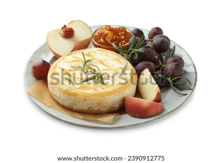 Tasty baked brie cheese with rosemary, fruits and jam isolated on white Royalty-Free Stock Photo #2390912775