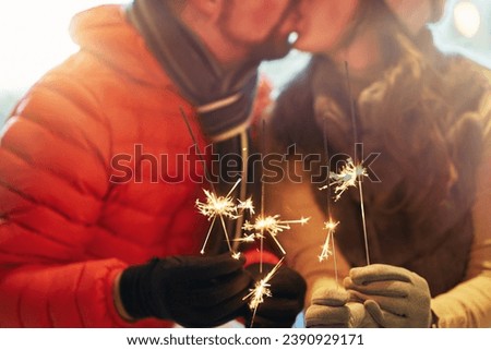 Photo of couple with New Year sparklers. High quality photo