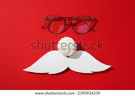 The face of Santa with glasses and a mustache